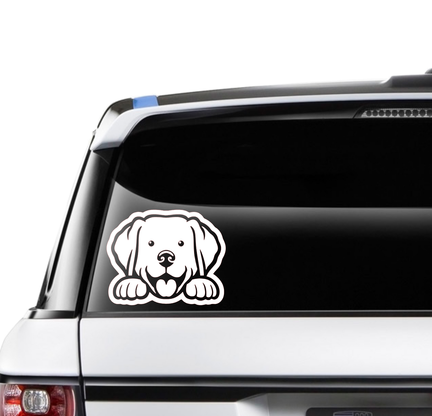 A white decal of a Labrador Retriever puppy's face peeking over a surface, applied on the rear window of a car.