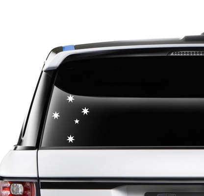 Car window with star-shaped decals on a white background