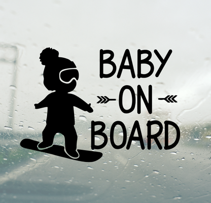 Silhouette of a baby on a skateboard with 'Baby on Board' text on a car window.